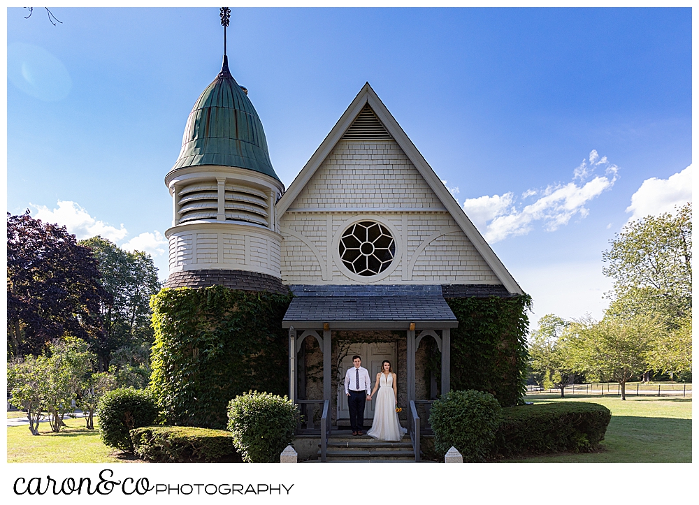 bride and groom standing on the porch of the chapel at Laurel Hill Cemetery