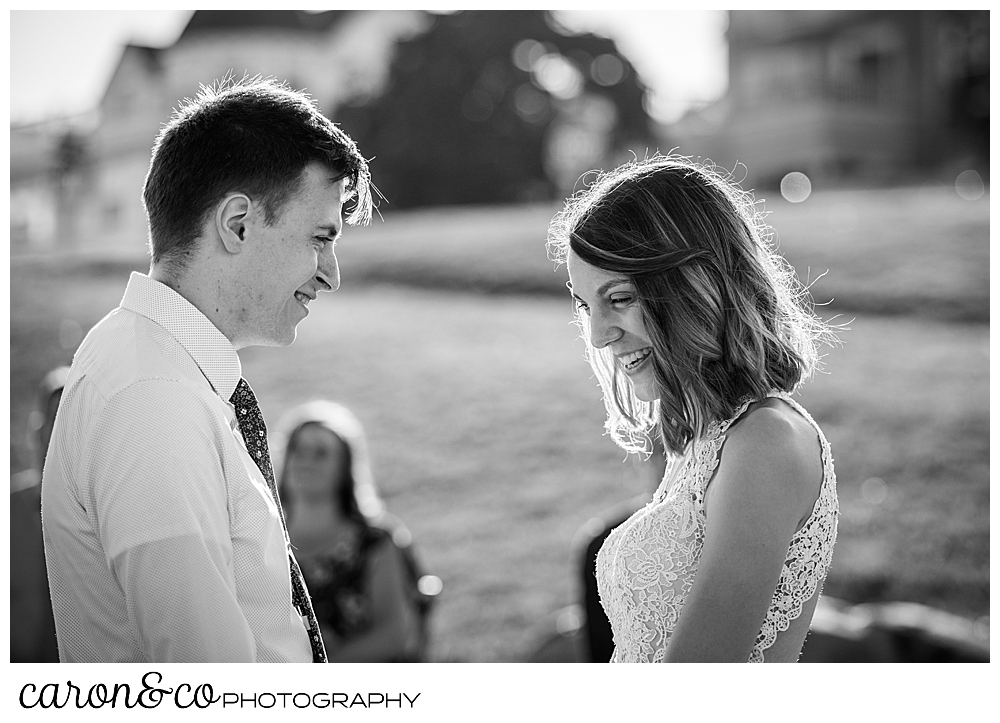 black and white photo of a bride and groom facing each other during their sweet Portland Maine elopement ceremony