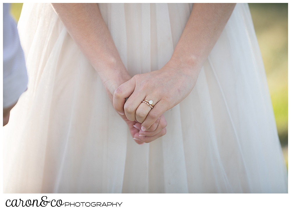 brides hands clasped during her sweet Portland Maine elopement ceremony