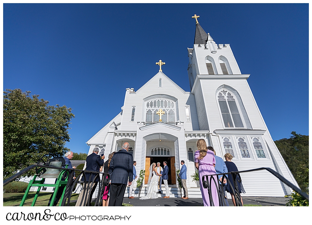 A micro wedding on the steps of Our Lady Queen of Peace Catholic Church at a timeless Boothbay Harbor wedding