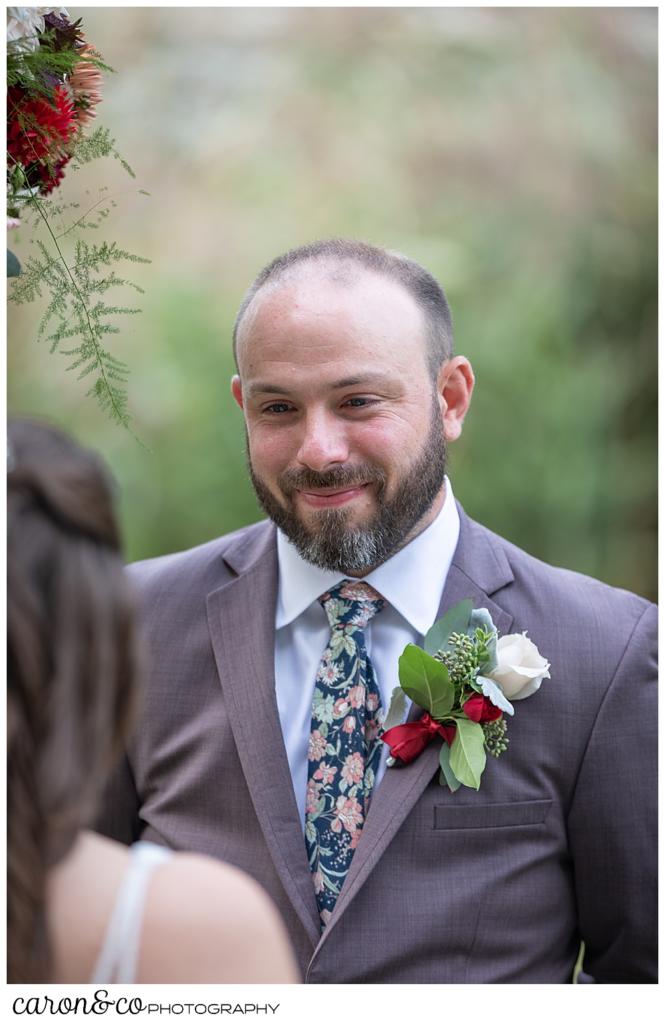 groom smiles at his bride during their charming kennebunkport Maine wedding