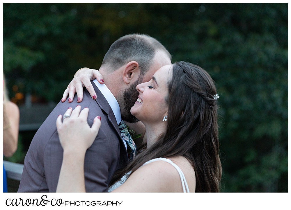 a bride and groom during their first dance at their charming Kennebunkport Maine wedding reception