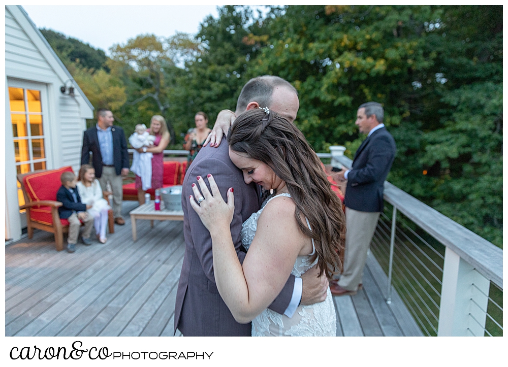 a bride and groom dance for the first time during their charming Kennebunkport Maine wedding reception