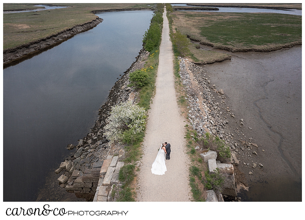 Pine Point Maine wedding photo of a bride and groom on the Scarborough Marsh Nature Trail, Pine Point Maine wedding images