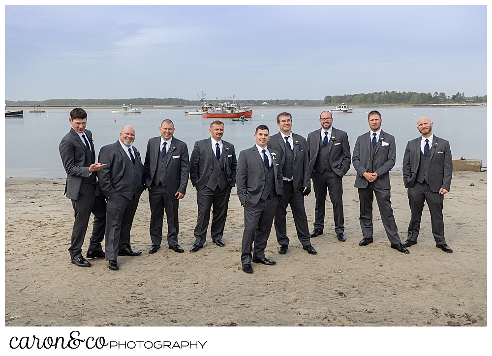 a groom and his groomsmen in gray, stand at Pine Point Beach, Scarborough, Maine