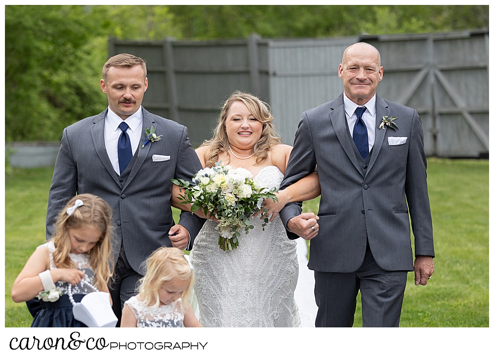 a bride walks down the aisle at the Landing at Pine Point Maine wedding venue, Scarborough, Maine