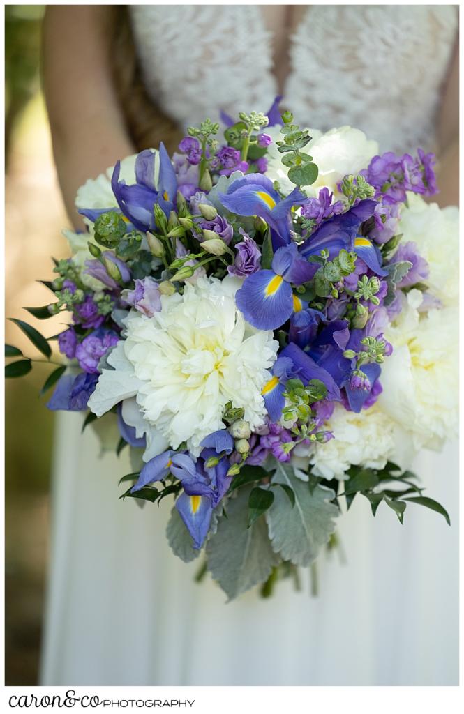 a beautiful blue, white, purple, and green bridal bouquet