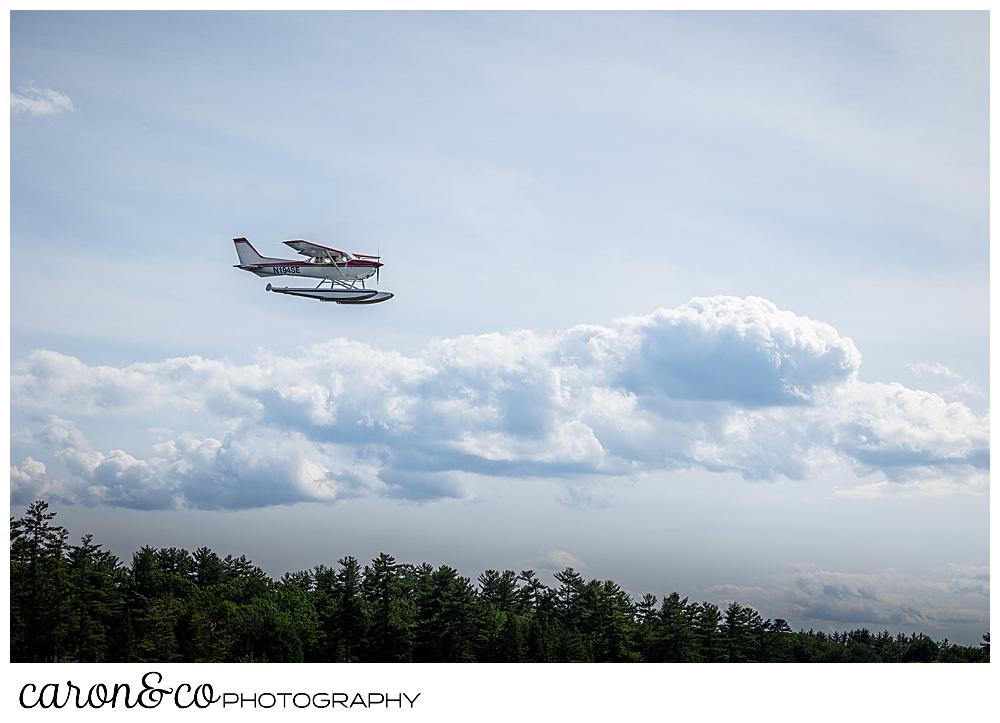 a float plane soars above Highland Lake, Bridgton Maine