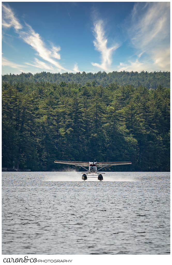 a sea plane lands on Highland Lake, Bridgton, Maine