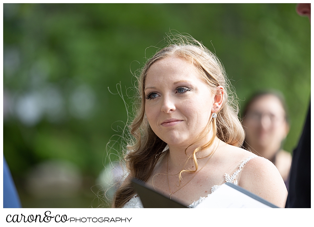 bride looking at groom during their Highland Lake Maine wedding ceremony