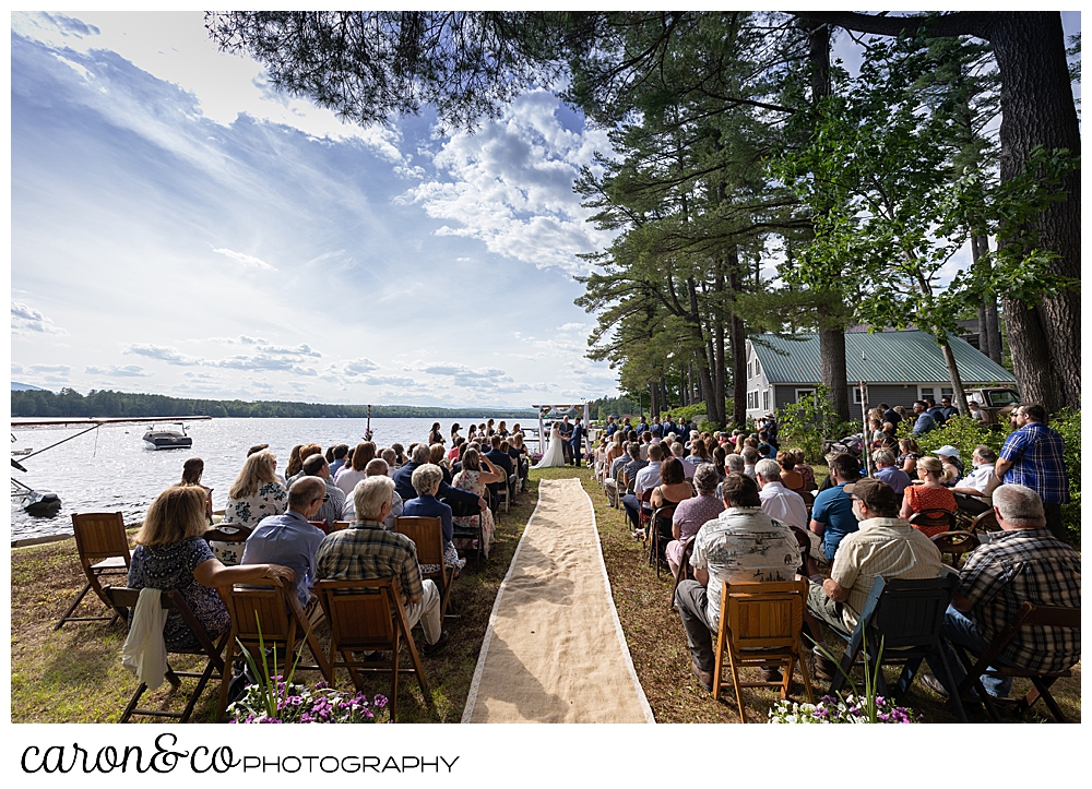 wide view of a highland lake maine wedding ceremony