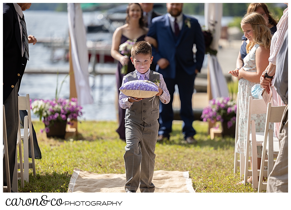 ring bearer during a highland lake maine wedding recessional