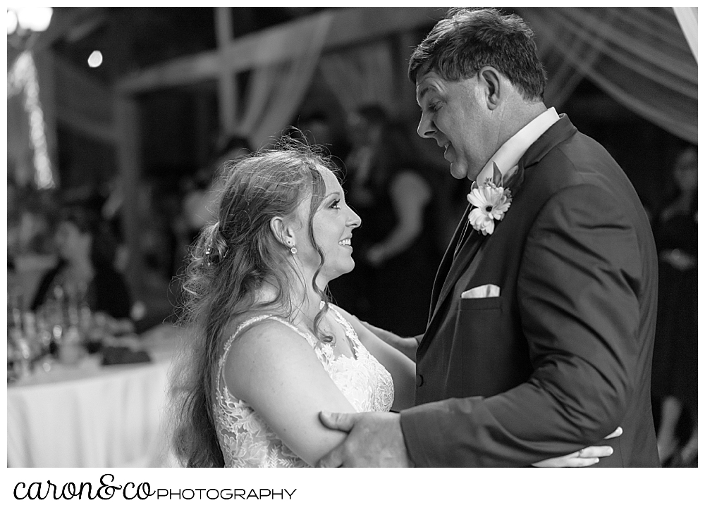 black and white photo of a bride and her father dancing together