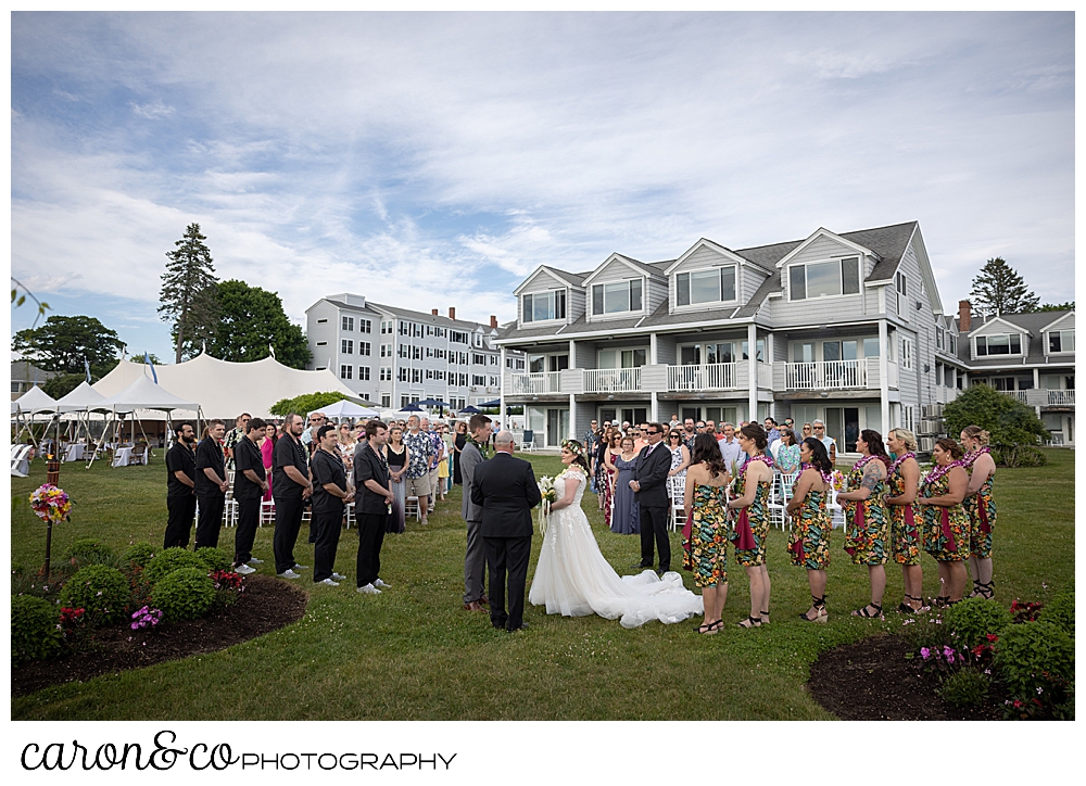 a wedding ceremony on the lawn with the Nonantum Resort in the background, Kennebunkport, Maine