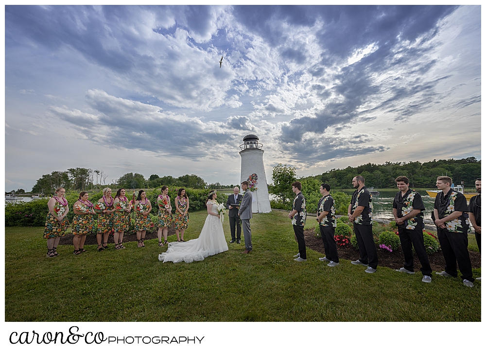 a bride and groom and their wedding party at an outdoor wedding ceremony at the Nonantum Resort, Kennebunkport, Maine