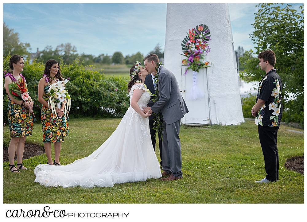 a bride and groom have their first kiss at a Nonantum Resort wedding ceremony, Kennebunkport, Maine