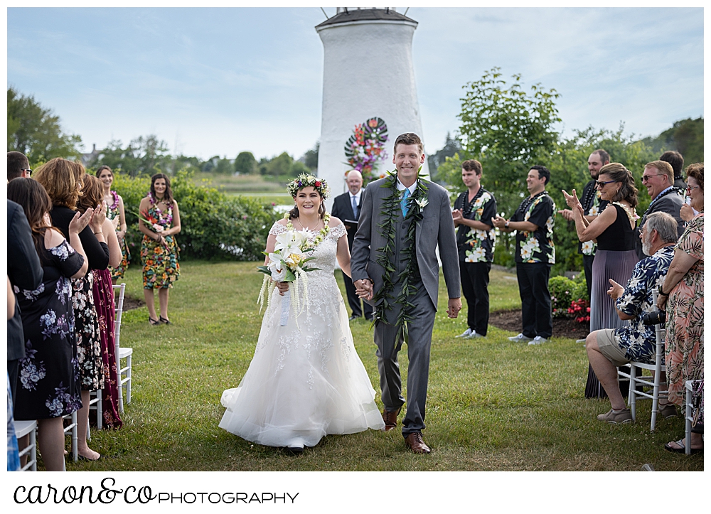 a bride and groom during their Nonantum Resort wedding recession, Kennebunkport, Maine