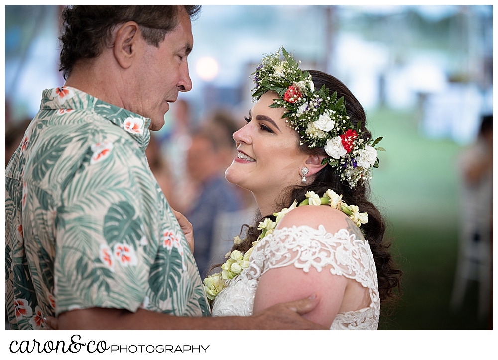 a bride dances with her father during the father daughter dance at a Nonantum Resort tented wedding reception