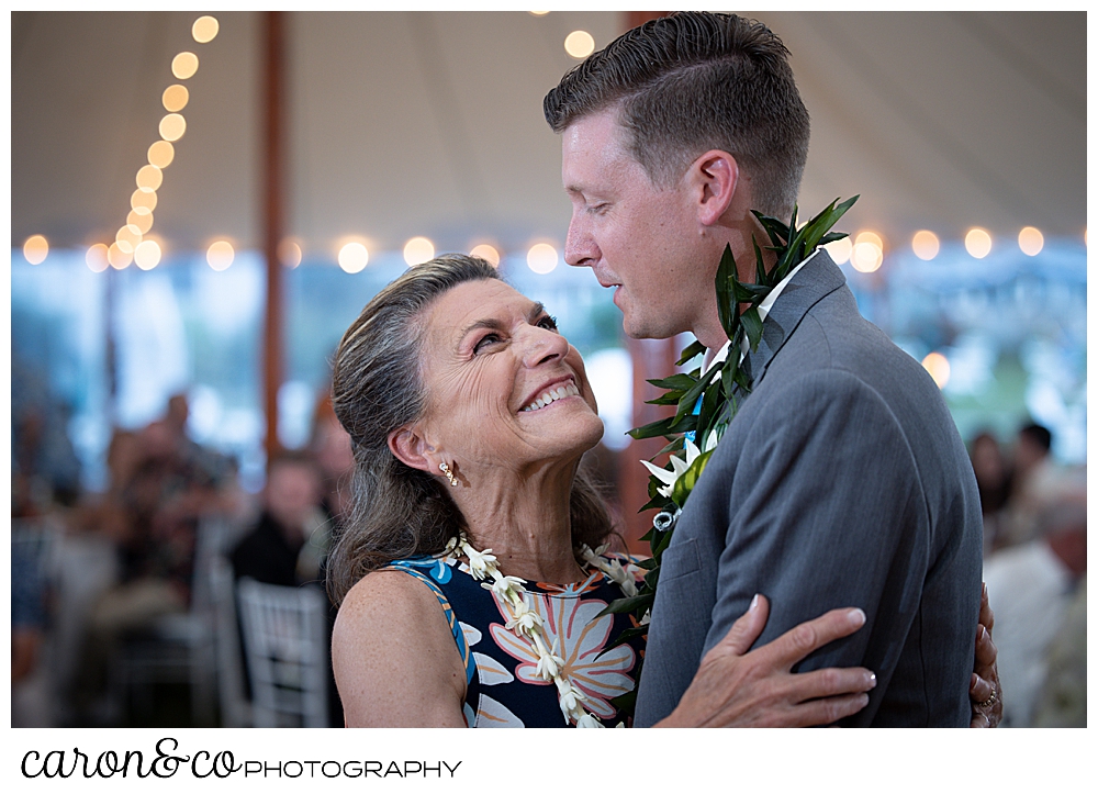 a groom dances with his mother during the mother son dance at a Nonantum Resort tented wedding reception