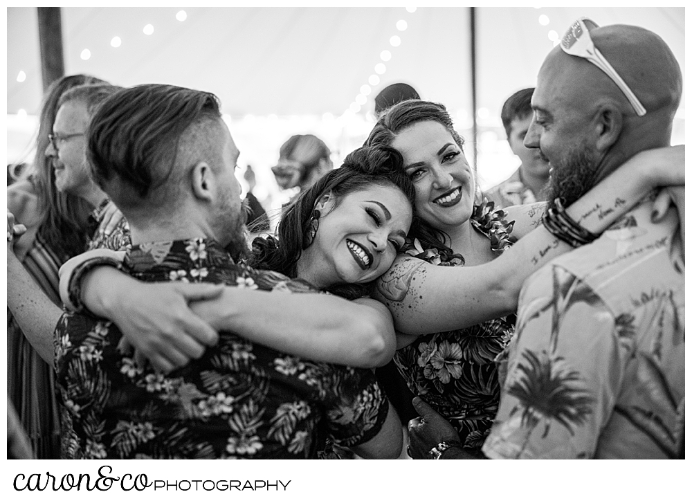 black and white photo of two couples dancing at a Nonantum Resort tented wedding reception