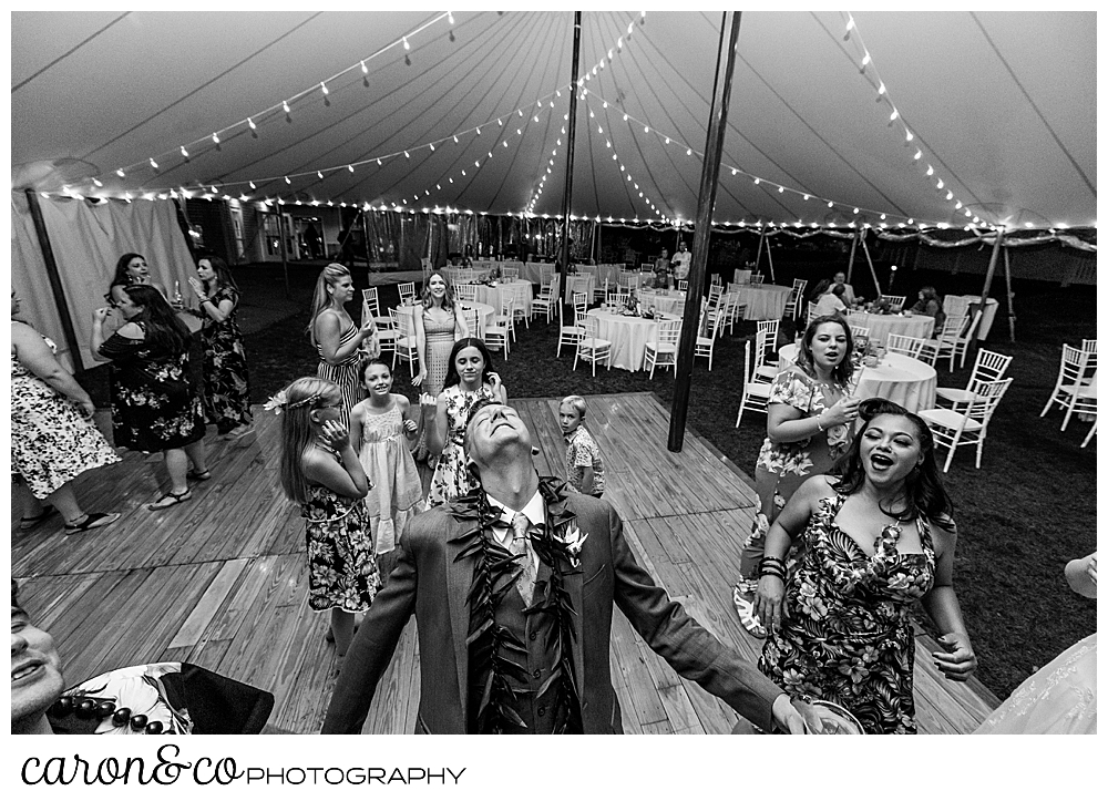 black and white photo of a groom dancing at his Nonantum Resort tented wedding reception