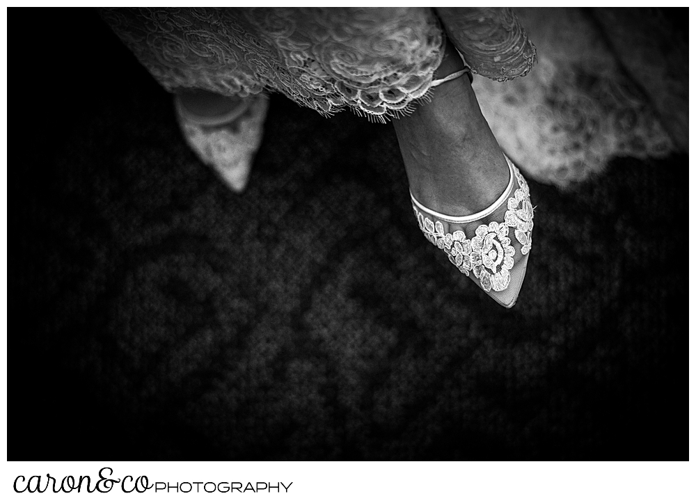 black and white photo of a bride wearing Bella Belle wedding shoes