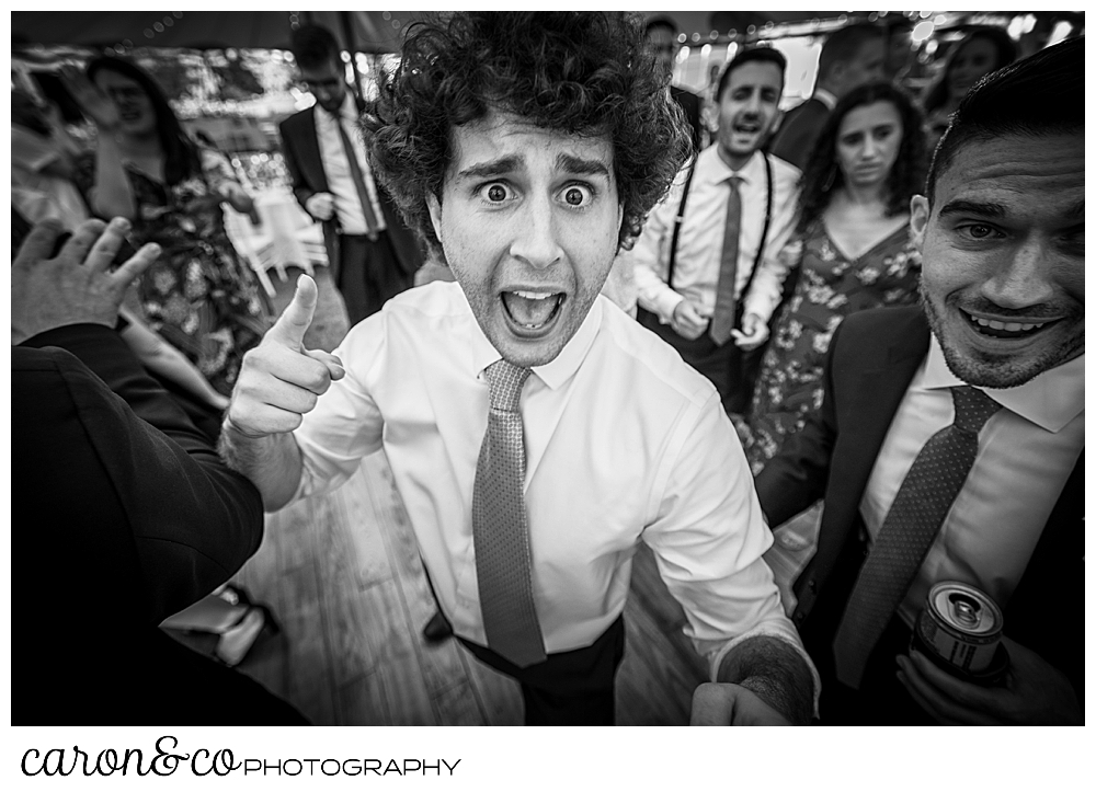 black and white photo of a man dancing close to the camera