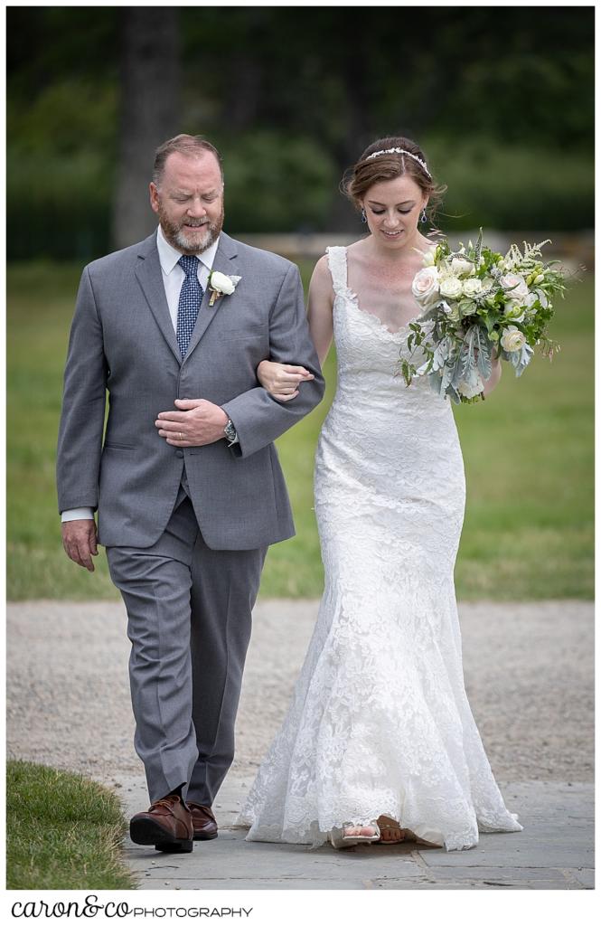 a bride and her father walk down the aisle at St. Ann's by-the-sea Episcopal Church, Kennebunkport, Maine