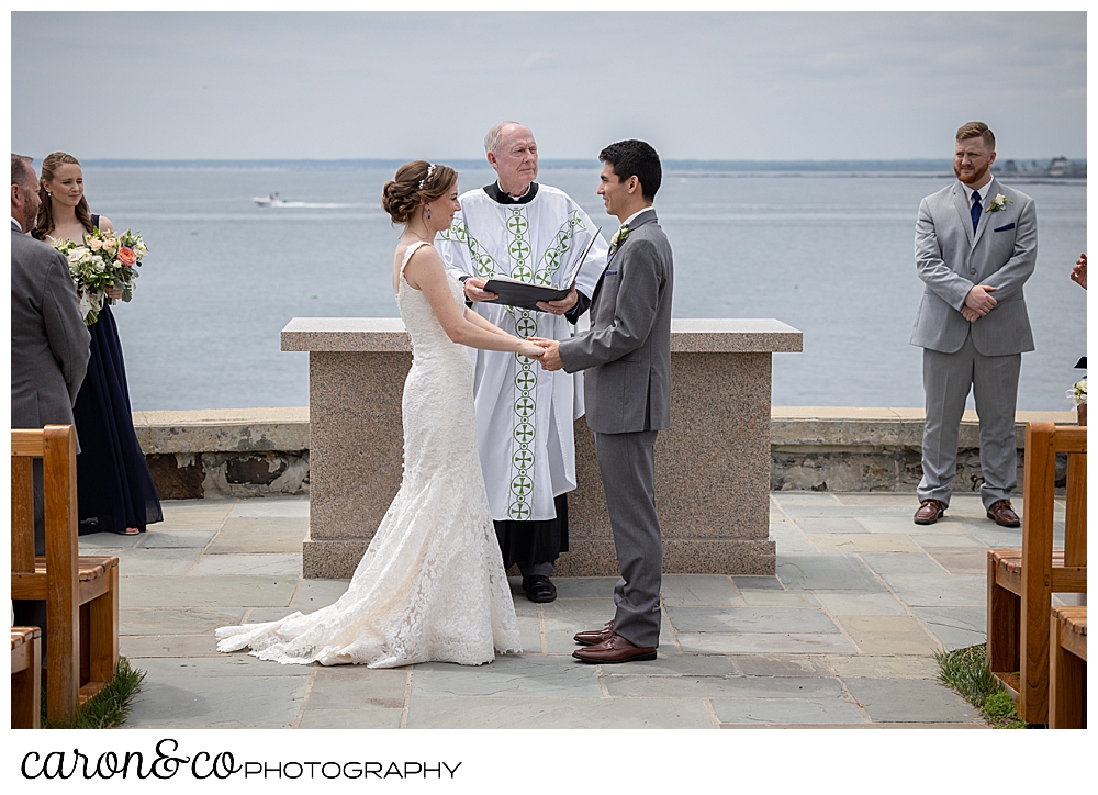 a bride and groom stand at the St. Ann's by-the-sea Episcopal Church outdoor wedding ceremony site, Kennebunkport, Maine