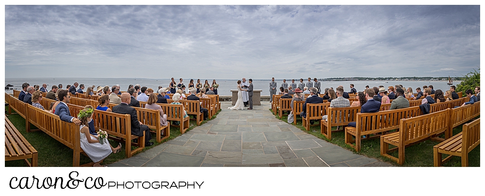 a panorama of an outdoor wedding ceremony at St. Ann's by-the-sea Episcopal Church in Kennebunkport, Maine