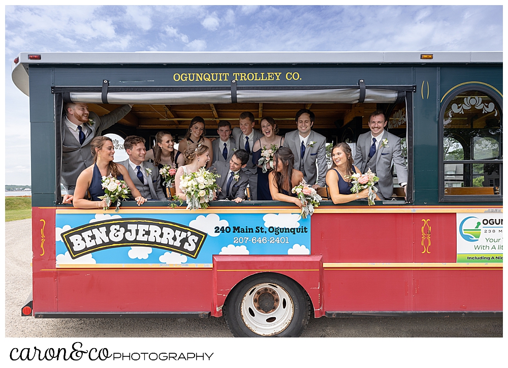 a bride and groom with their bridal party on an Ogunquite trolley