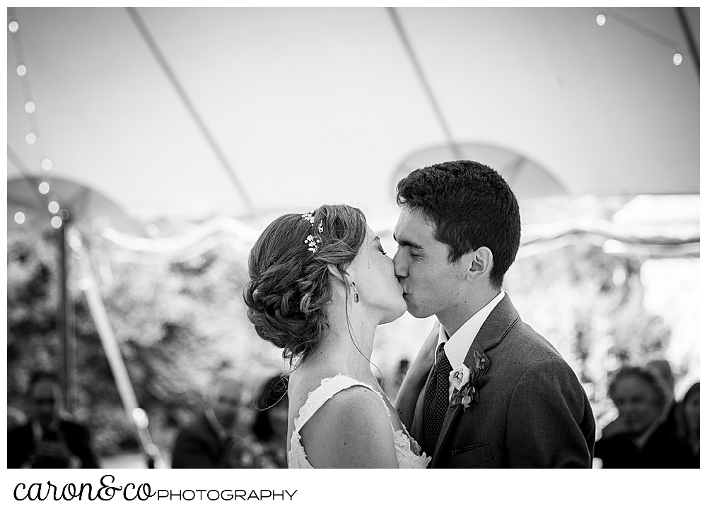 black and white photo of a bride and groom kissing during their Kennebunk Maine wedding reception