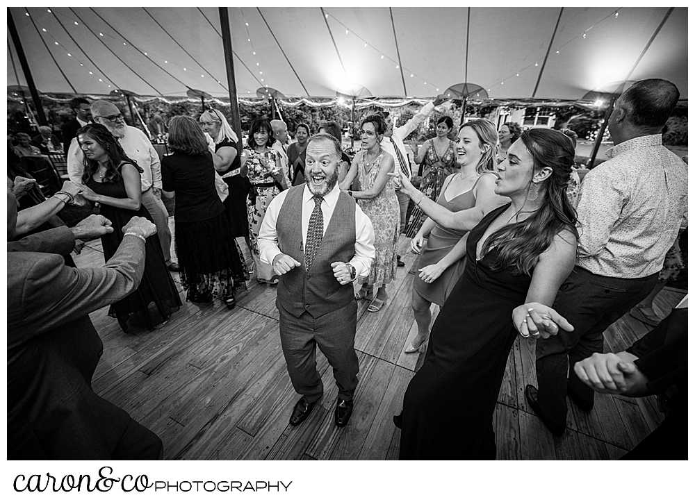 black and white photo of guests enjoying dancing at a Kennebunk Maine wedding reception