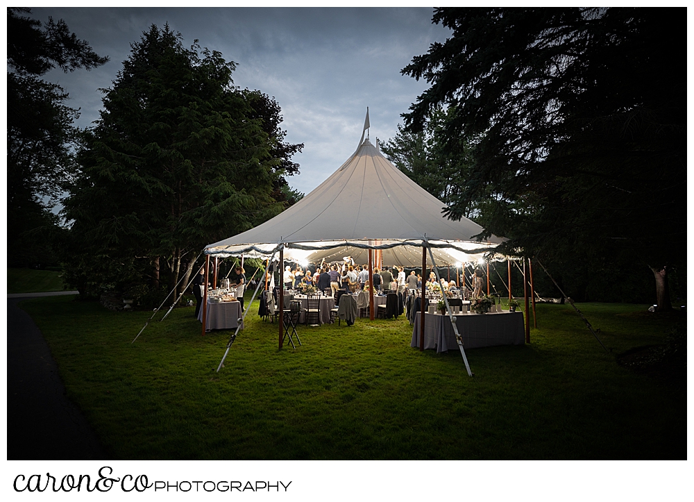 a lighted Sperry Seacoast wedding tent in the twilight during a Kennebunk Maine wedding reception