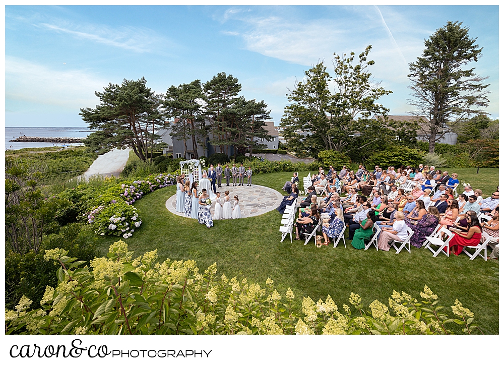 an outdoor wedding, from the side, of a Kennebunkport wedding at the Colony Hotel, Kennebunkport, Maine