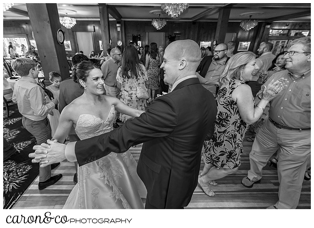 black and white photo of a bride and groom dancing at their Kennebunkport wedding at the Colony Hotel