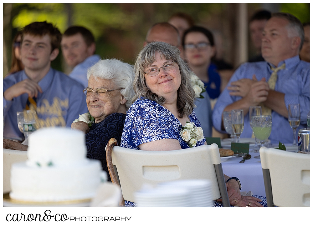 a mother and wife watches the father daughter dance at a sweet western Maine wedding reception