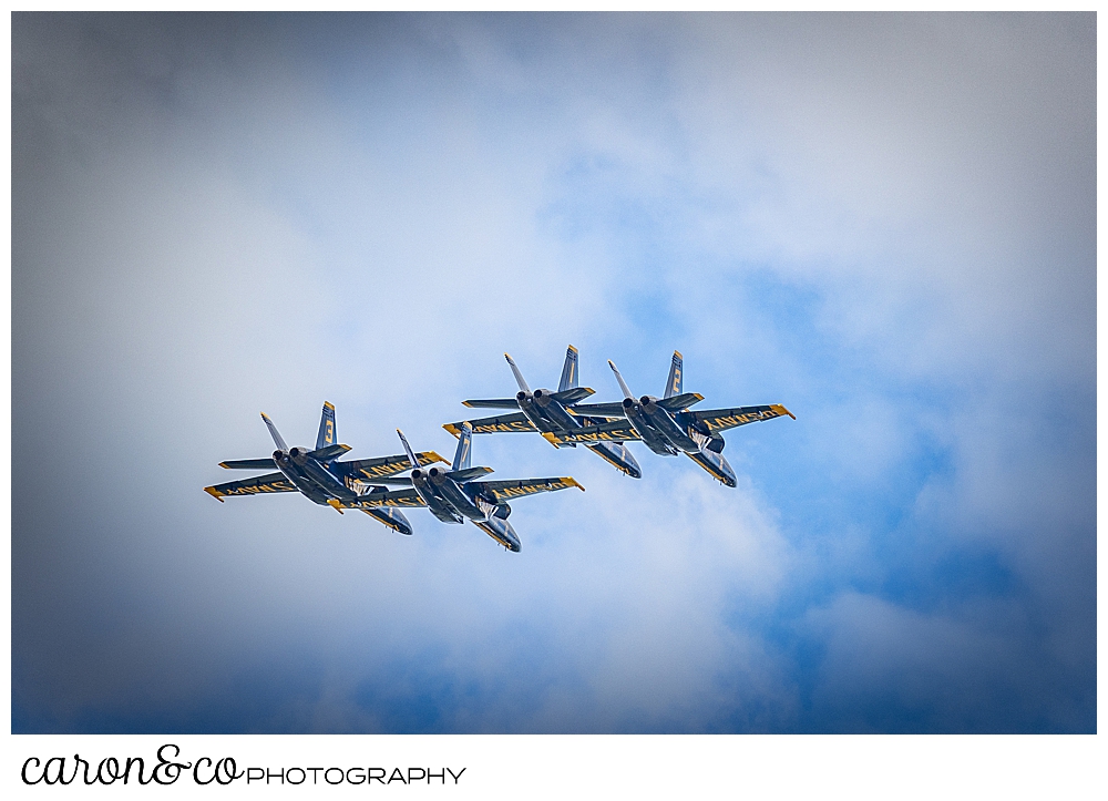 4 blue angels fly overhead in a cloudy sky at the Great State of Maine Airshow 2021