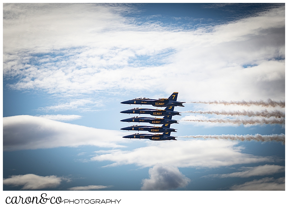 5 us navy blue angels flying in perfect formation at the Great State of Maine Airshow in Brunswick Maine