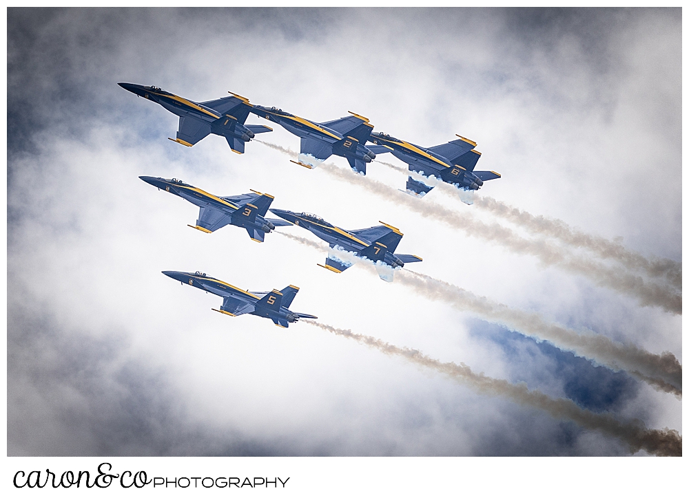 6 us navy blue angels flying in a group in the clouds