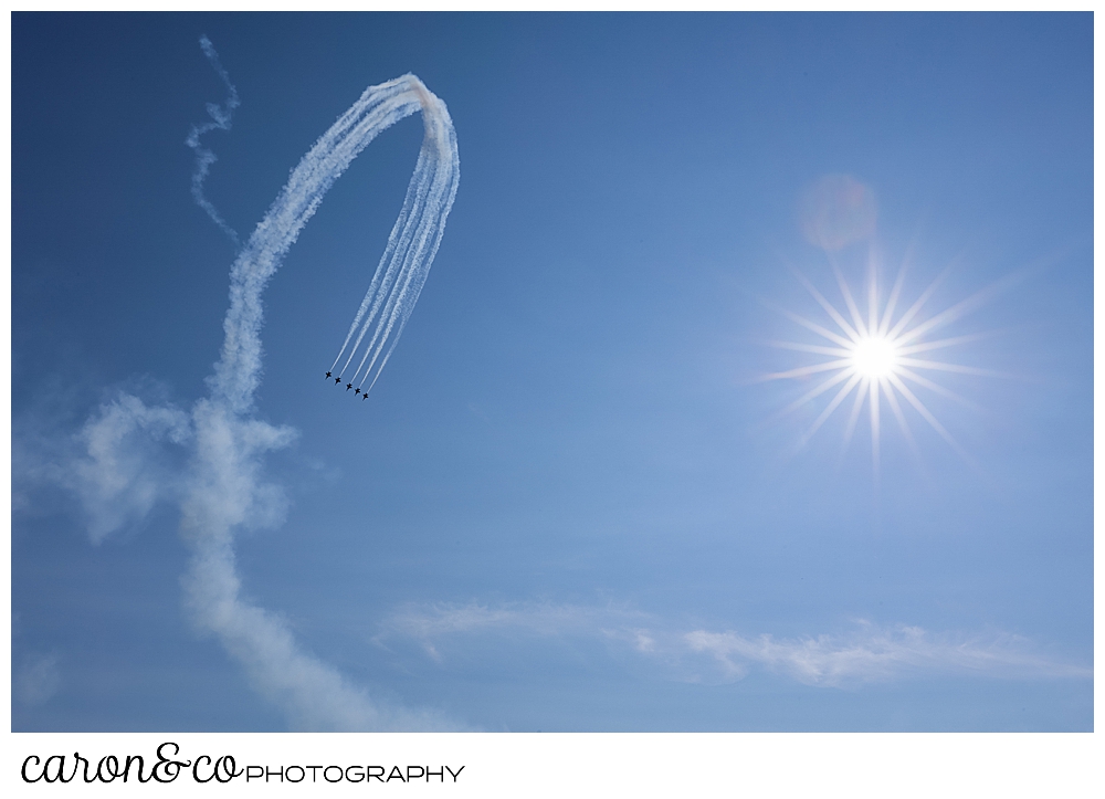 heavy contrails show the arc of the us navy blue angels in flight