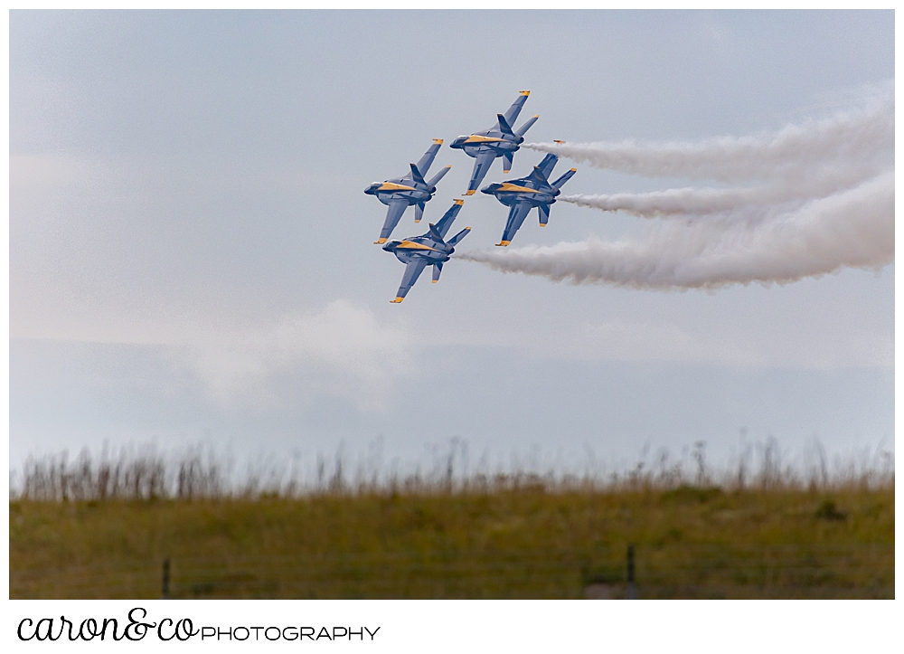 4 us navy blue angels flying in formation over Brunswick, maine