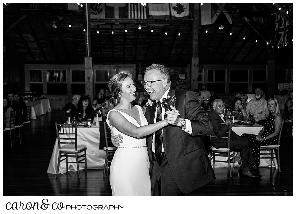 black and white photo of a bride and her dad during their father daughter dance