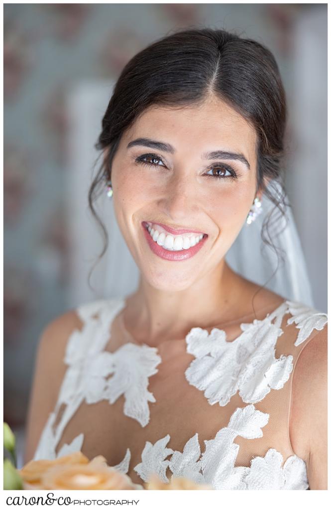 a bridal portrait of a beautiful dark haired, smiling, bride