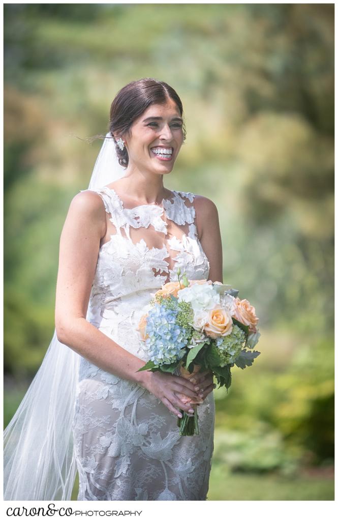 a dark-haired bride smiles during her Maine wedding day first look at the Colony Hotel, Kennebunkport, Maine