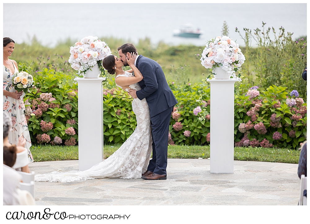 a bide and a groom during a first kiss at a coastal Maine wedding at the Colony Hotel Kennebunkport Maine