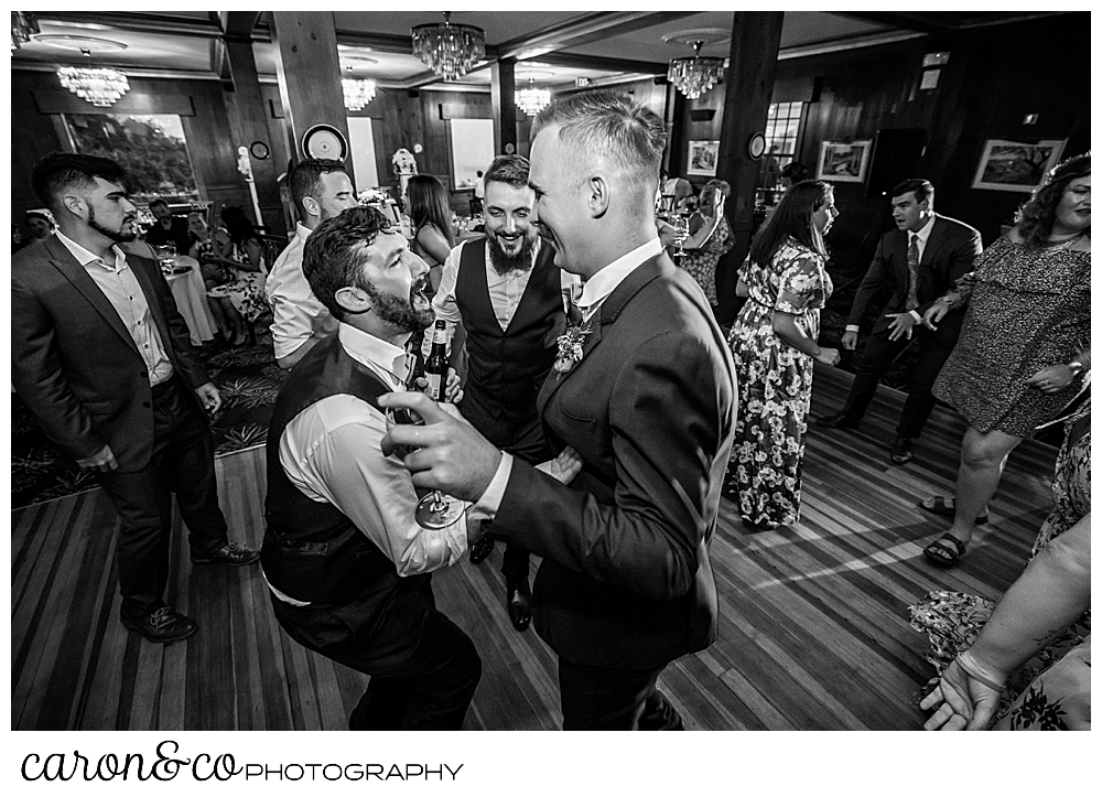 black and white photo of men dancing at a coastal Maine wedding at the Colony Hotel Kennebunkport Maine