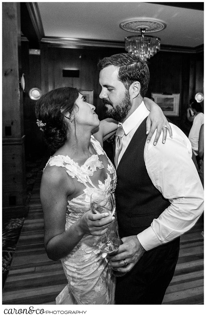 a black and white photo of a bride and groom embracing on the dance floor at their coastal Maine wedding at the Colony Hotel Kennebunkport Maine