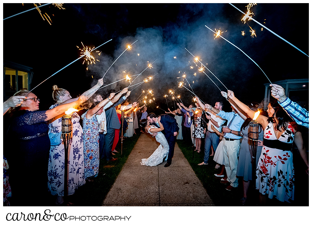 a sparkler exit with a groom dipping his bride, at a coastal Maine wedding at the Colony Hotel Kennebunkport Maine