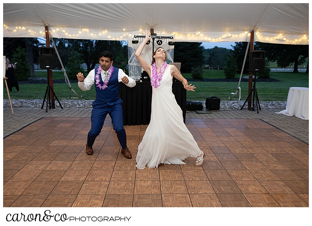 bride and groom doing a choreographed first dance, the bride's head is thrown back